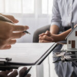 Real,Estate,Agent,And,Customer,Discussing,For,Contract,To,Buy,